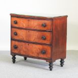 A 19th century mahogany bow front chest of drawers, on turned feet,