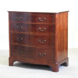 An Edwardian mahogany serpentine chest, containing four long drawers, on bracket feet,