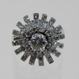 An unmarked diamond cluster ring, of star shape, size N, 6.