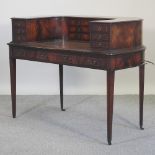 A reproduction desk, of Carleton House design,