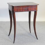 A 19th century French flame mahogany work table, on swept tapered legs,