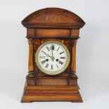 A 19th century burr walnut cased mantel clock, with a painted dial,