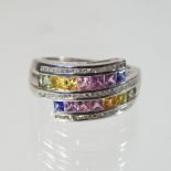 A modern 9 carat gold, sapphire multi gem set dress ring, of crossover design, size R, 6.