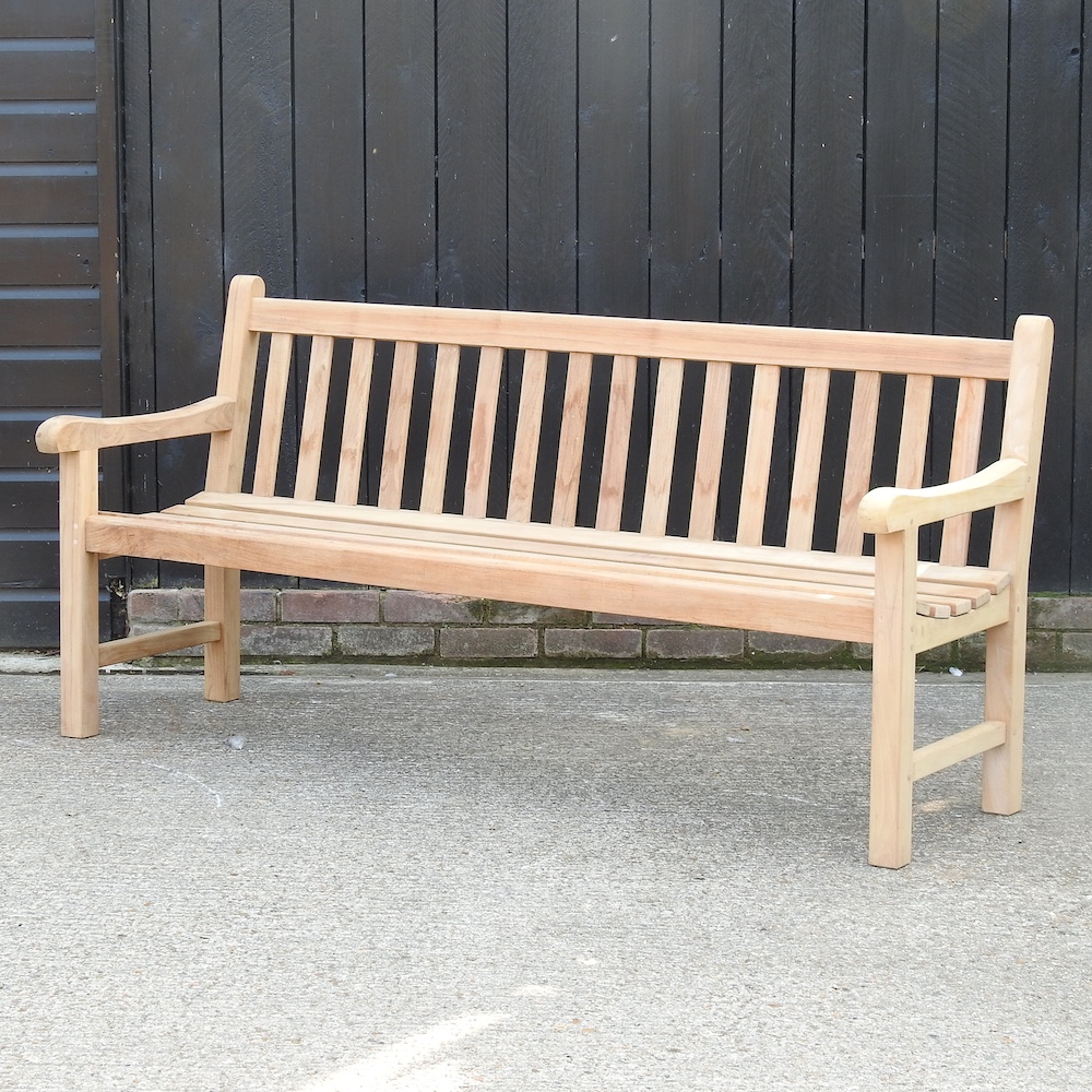 A teak slatted garden bench, with a cover,