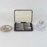 A Victorian cut glass inkwell with a silver cover, London 1893,