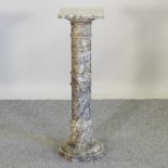 A carved green veined marble column,