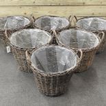 A set of six circular wicker log baskets,