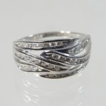 A 9 carat white gold and diamond set dress ring, of multi crossover design, size R, 3.