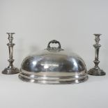 A large 19th century silver plated meat cover, together with a pair of silver plated candlesticks,