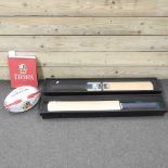 A signed Lions tour rugby ball, with commemorative book, together with two signed cricket bats,