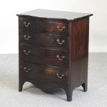 An early 20th century mahogany serpentine chest,