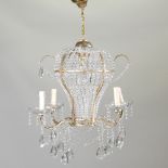 A modern crystal and gilt metal chandelier,
