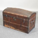An early 20th century metal bound dome top trunk, painted with initials GB,