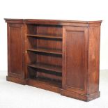 An early 20th century oak breakfront bookcase,
