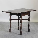 A 1920's drawer leaf dining table, of small proportions,