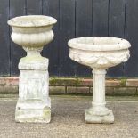 A reconstituted stone garden urn, on stand, 83cm high overall, together with another smaller,