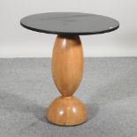 An Art Deco style occasional table, with a circular slate top,