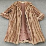 A ladies vintage fur coat