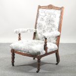 A Victorian walnut and cream upholstered armchair,