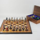 A modern wooden chess set, together with a hand painted chess set,
