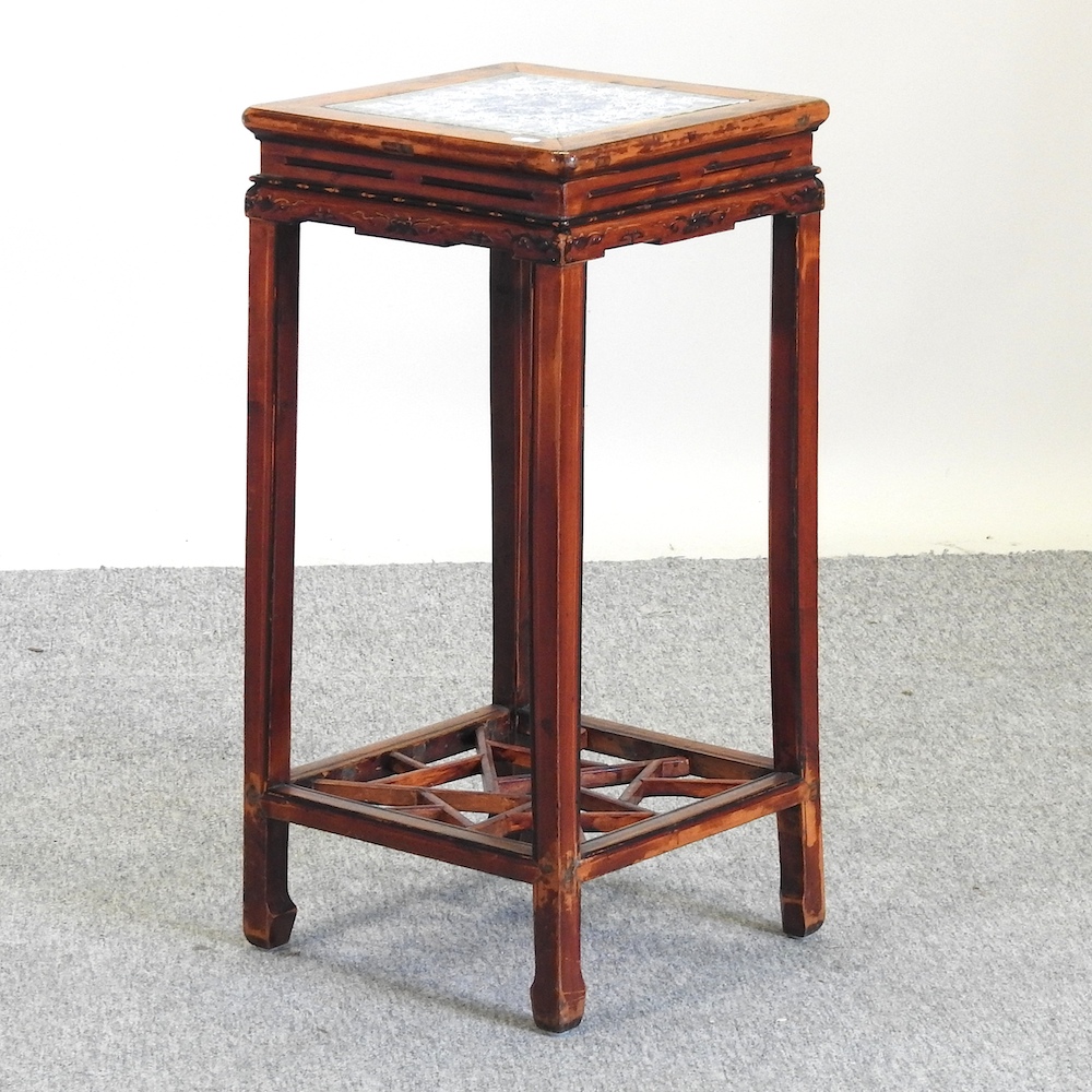 A 20th century Chinese stand, with a blue and white glazed tile top,