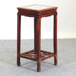 A 20th century Chinese stand, with a blue and white glazed tile top,