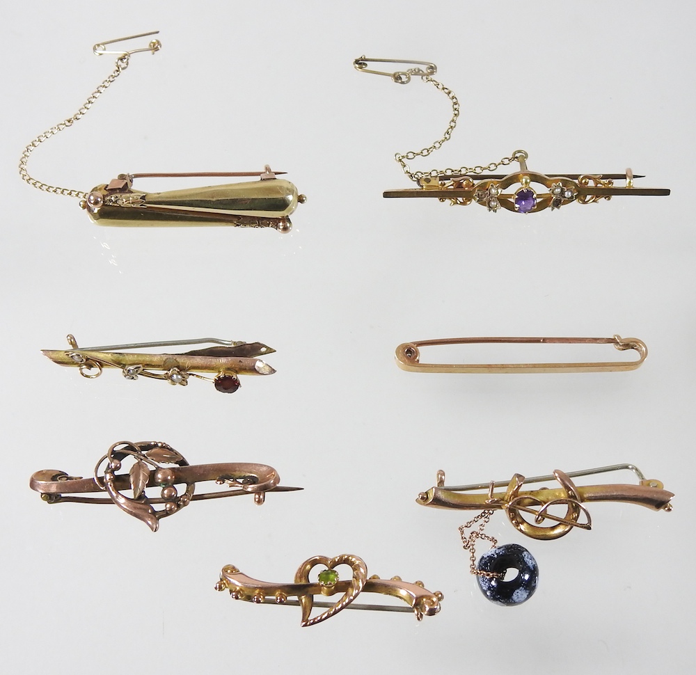 A collection of seven various 9 carat gold bar brooches,