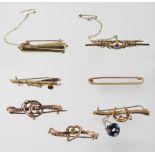 A collection of seven various 9 carat gold bar brooches,