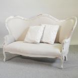A recently upholstered Victorian style show frame sofa,