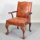 A 20th century upholstered desk chair, of Chippendale design,