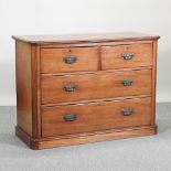 A Victorian walnut chest, containing two short over two long drawers,