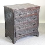 An 18th century and later carved dark oak chest of drawers,
