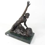 A modern bronze figure of a man, with his arm raised, on a marble base,