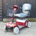 A red strider mobility scooter,