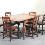 A 1920's oak draw leaf dining table, 176 x 106cm overall,
