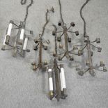A collection of five metal ceiling lights,