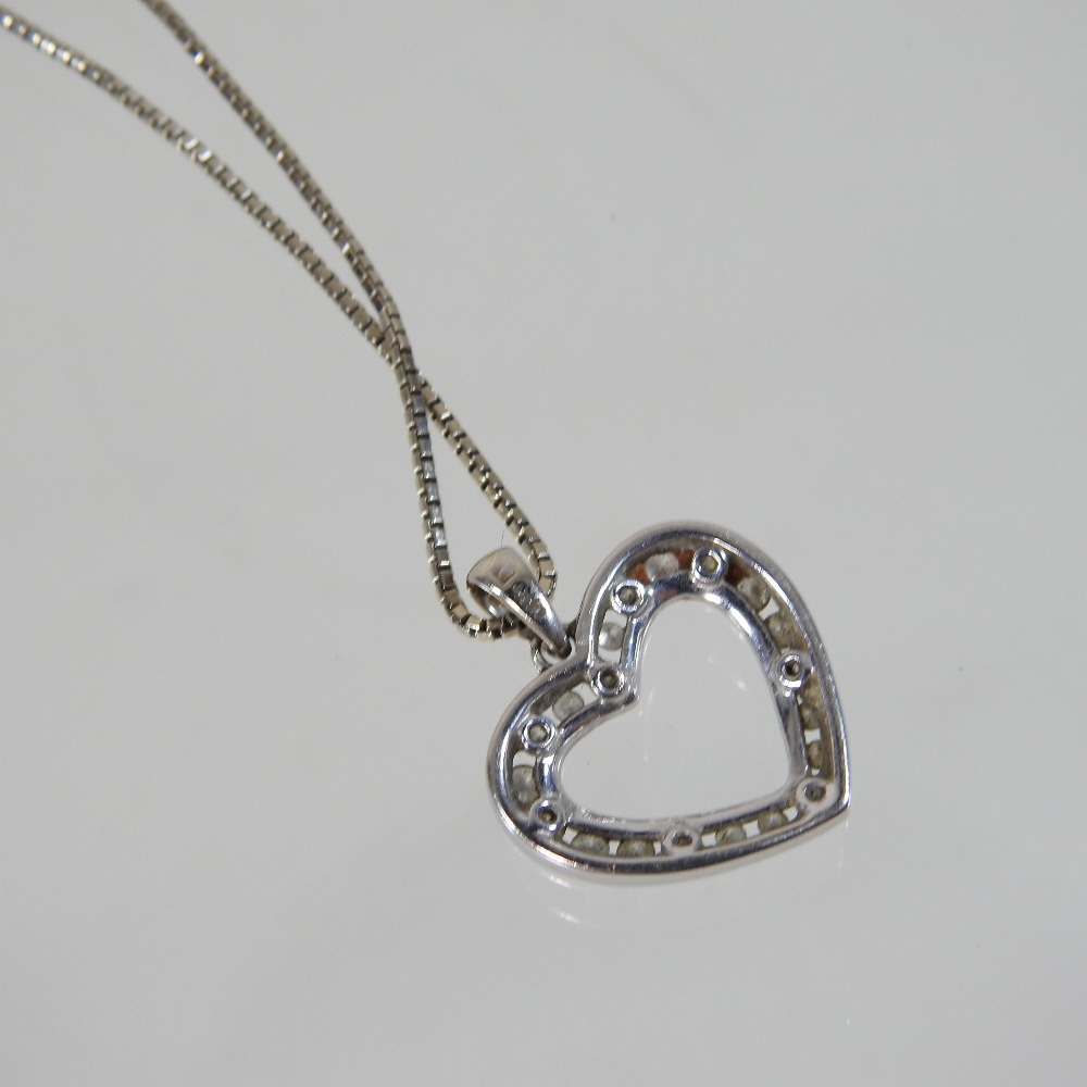 A 14 carat gold and diamond heart shaped pendant, 2cm wide, on a fine chain, 6. - Image 2 of 7