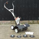 A Stihl petrol driven garden scarifier and aerator,