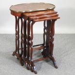 A nest of four early 20th century French marquetry occasional tables,