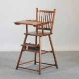 A 20th century oak child's stick back high chair