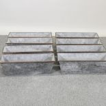 A set of eight rectangular galvanized metal planters,