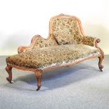 A Victorian walnut and floral upholstered chaise longue,