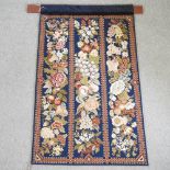 A tapestry hanging panel, decorated with fruits and flowers,