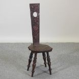 A 19th century carved oak spinner's chair