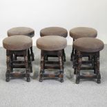 A set of six turned wooden stools,