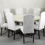 A set of eight cream upholstered high back dining chairs,