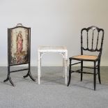 An ebonised cane seated chair,