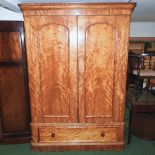 A Victorian maple double wardrobe, with a fitted interior,