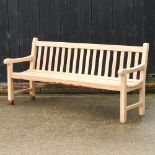 A teak slatted garden bench,