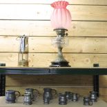 A Victorian brass oil lamp, with a ruby glass shade, 52cm high overall,